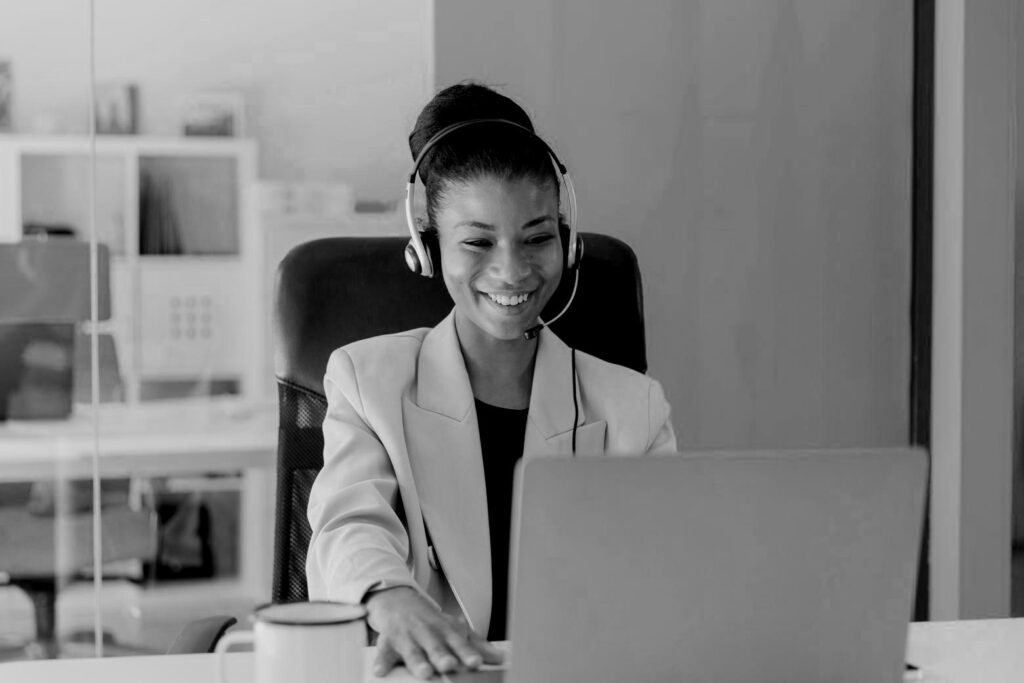 Woman happily working from home.