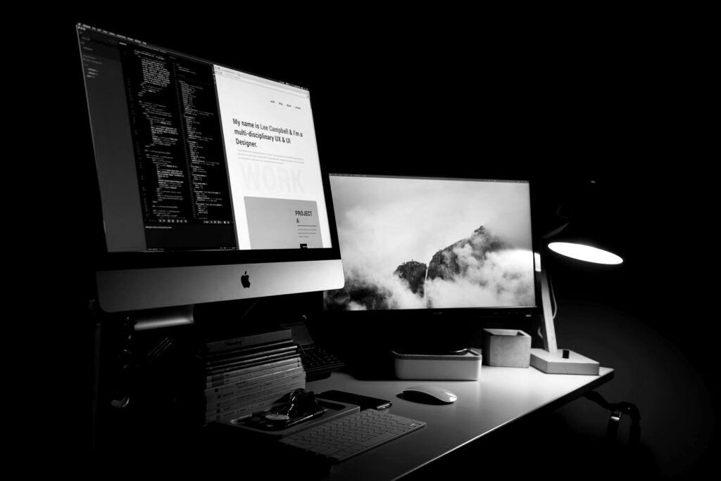 Desktop computer set up with two monitors for web design creation