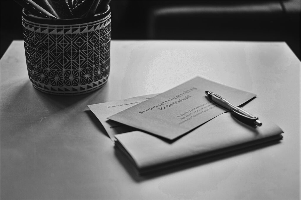 Black and white photo of a mail envelope on a table